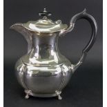 A Regency style silver hot water pot, Emile Viner, Sheffield 1932, of lobed oval bulbous form,
