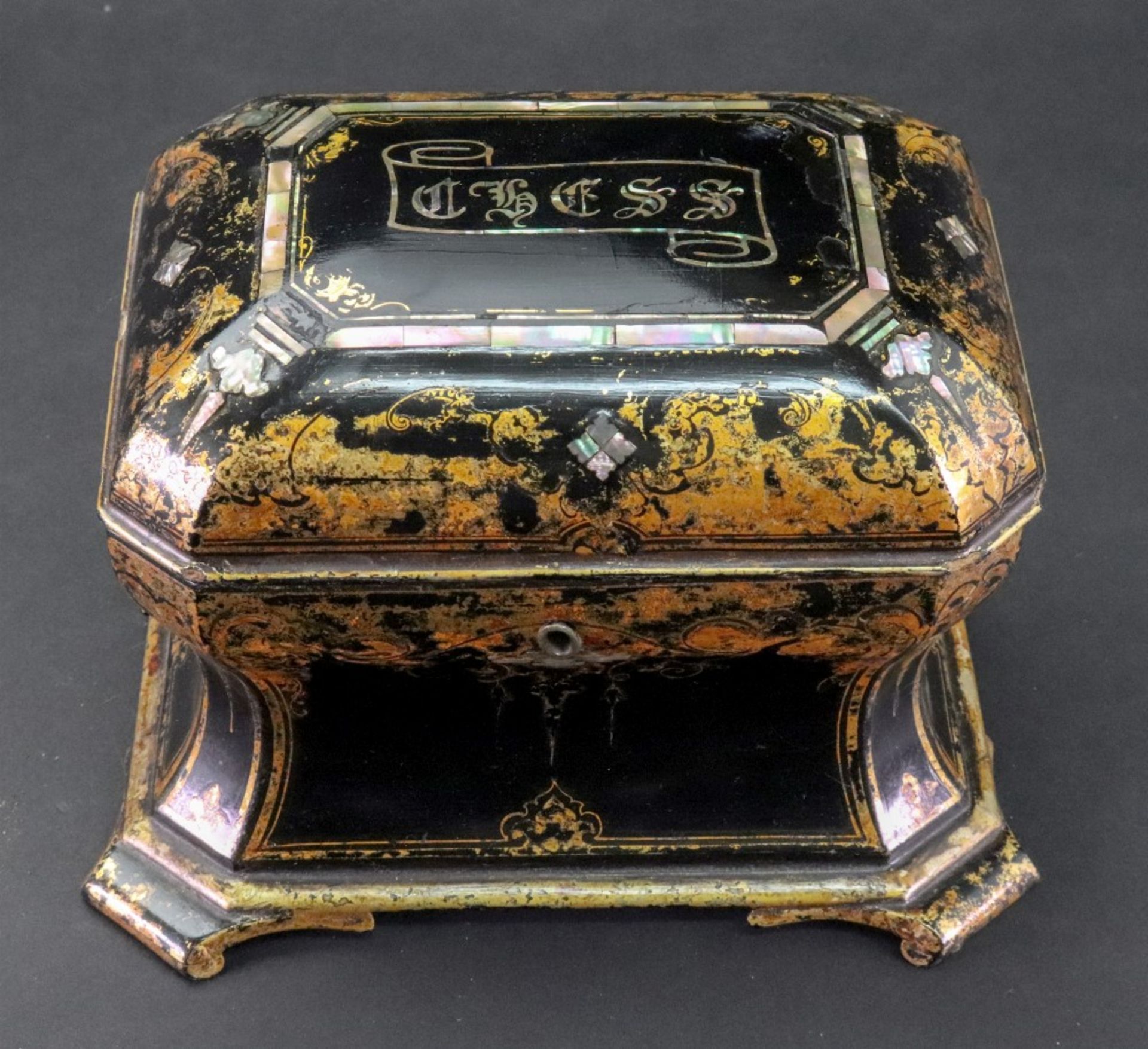 A Victorian papier mache chess box, stamped Jennens & Bettridge, of sarcophagus form,