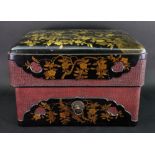 A Japanese rectangular lacquer box and cover, Meiji, with gilt flowering branches on a black ground,