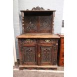 A late 17th century oak dwarf cupboard, altered, of panelled construction,