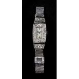 A diamond set cocktail watch, circa 1920's/30's, the rectangular dial with Arabic numerals,