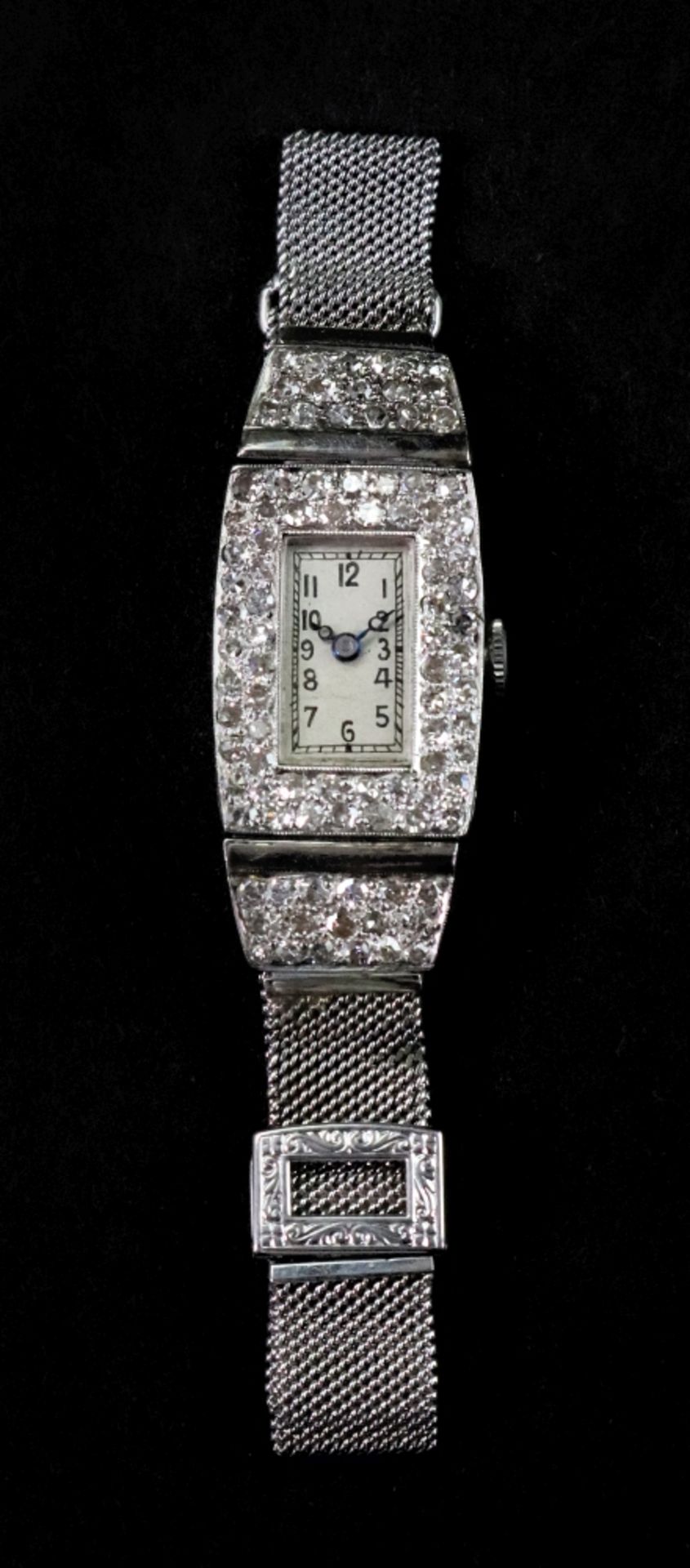 A diamond set cocktail watch, circa 1920's/30's, the rectangular dial with Arabic numerals,