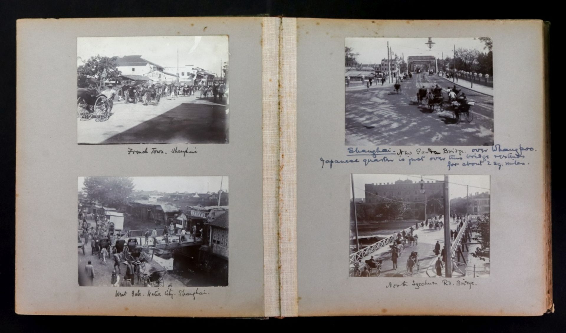 Shanghai: a green cloth photograph album circa 1918, of views in Shanghai including the river,