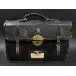 A black leather briefcase with the insignia EIIR in gilt and chubb lock, lacks key, 41cm wide.