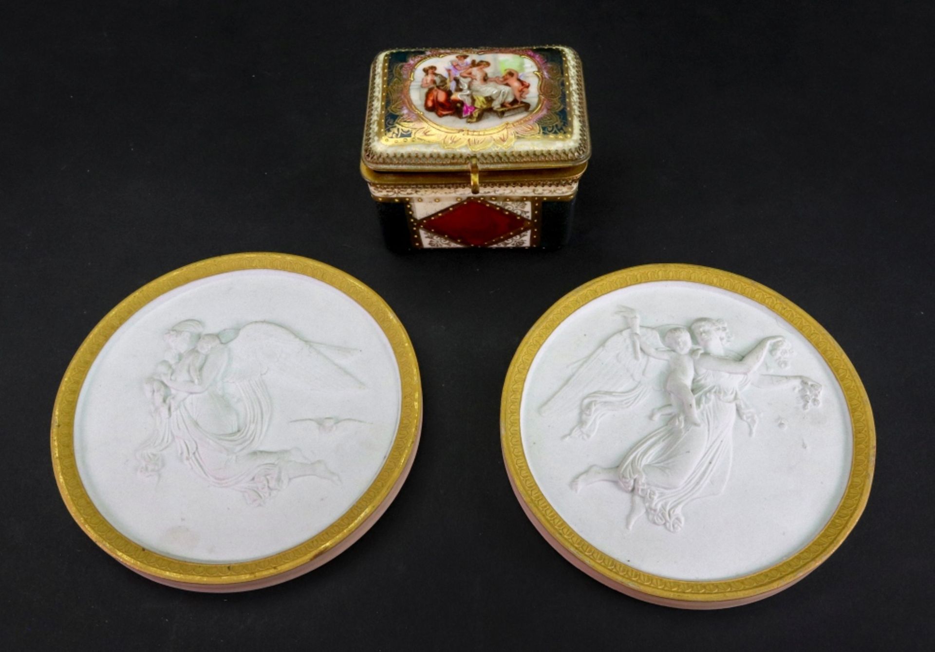 A pair of Royal Copenhagen biscuit small circular plaques, late 19th century,