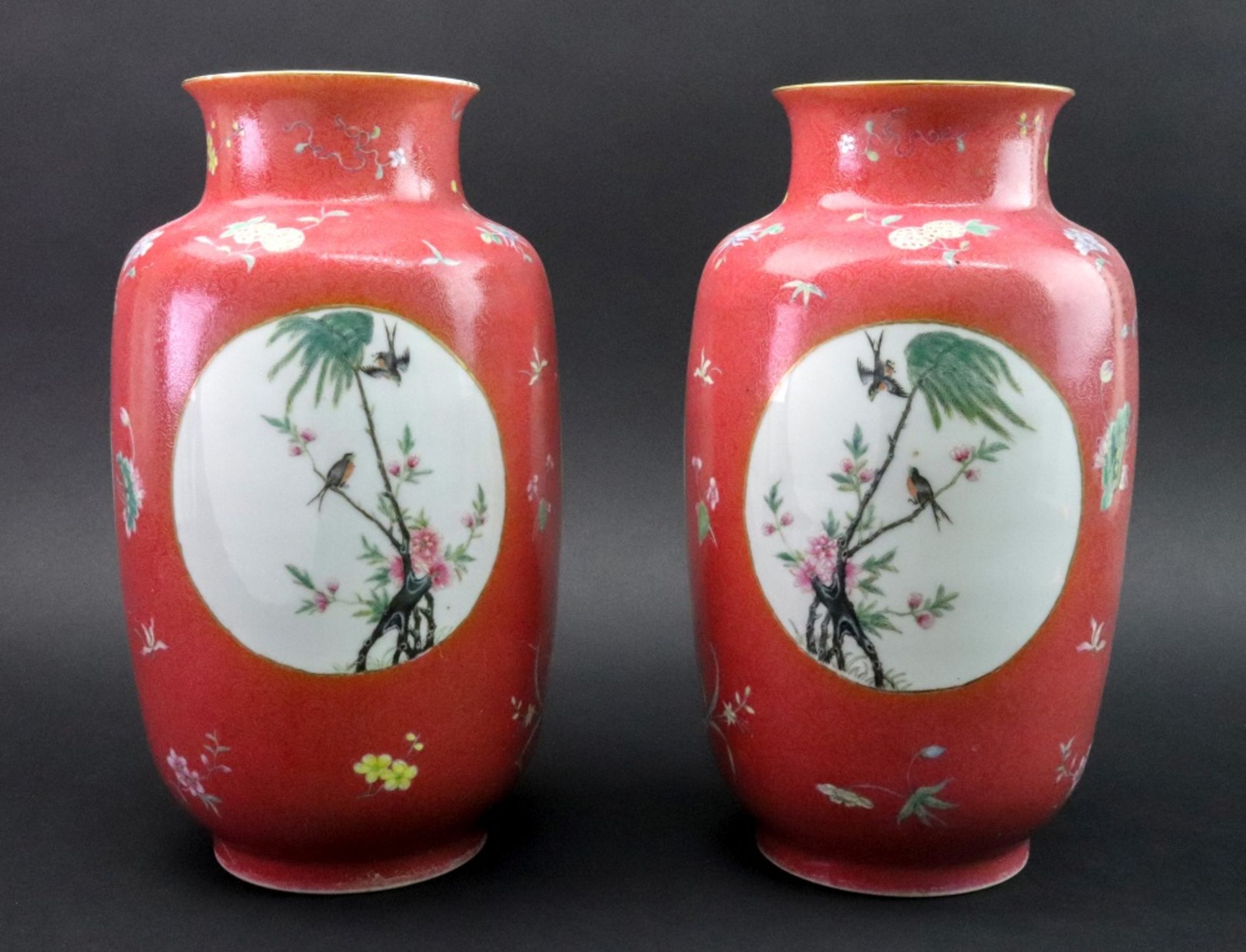 A pair of Chinese pink ground sgraffito famille rose vases, Republic period,