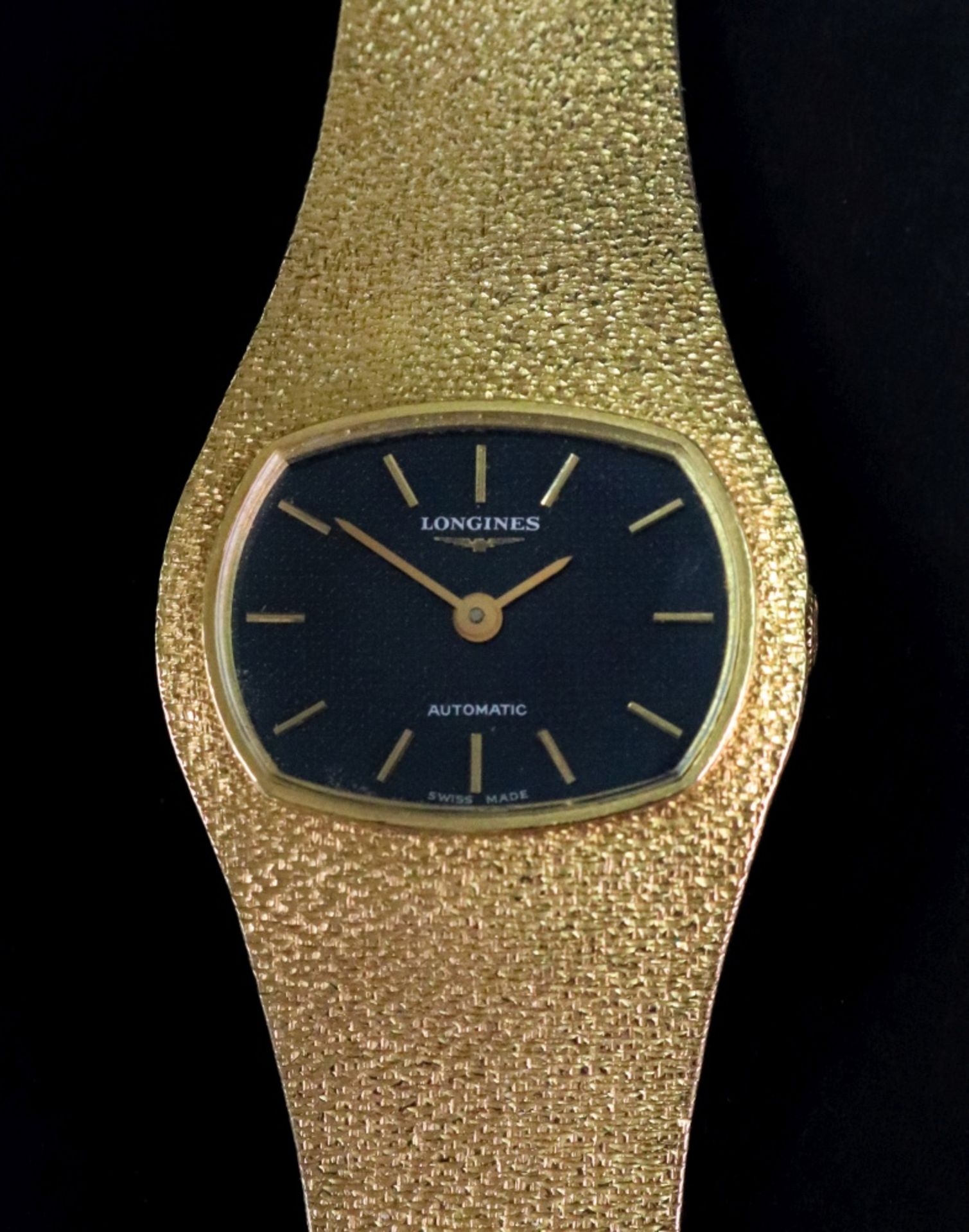 Longines; Automatic, a lady's 18ct gold wristwatch,