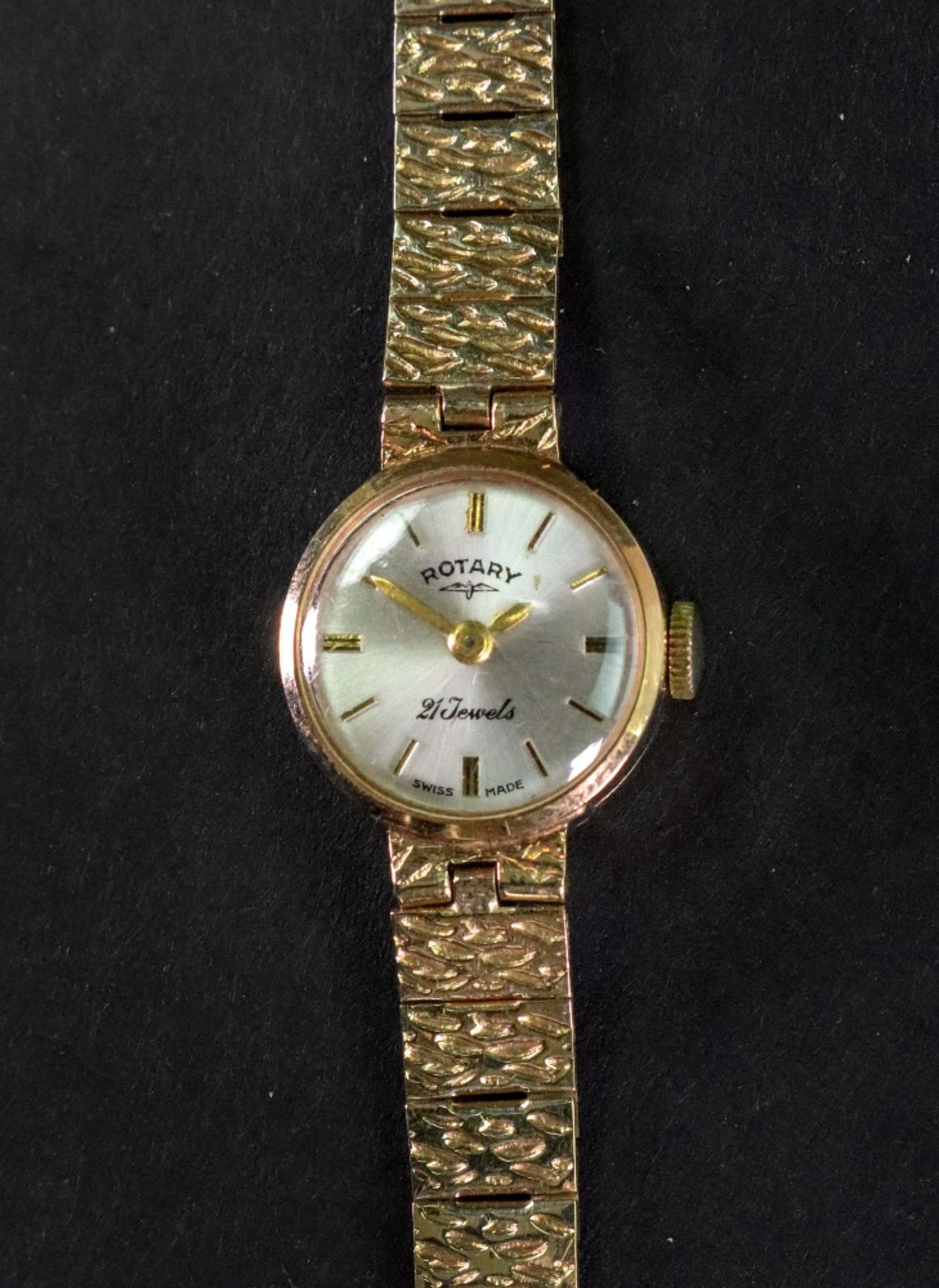 Rotary; a lady's 9ct gold bracelet watch, the dial with raised baton hour markers and hands,