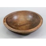 A turned fruitwood dairy bowl, 19th century, 50cm diameter x 15cm high.