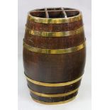 A brass bound oak oval brandy barrel, 20th century, later adapted as a six-division stick stand,