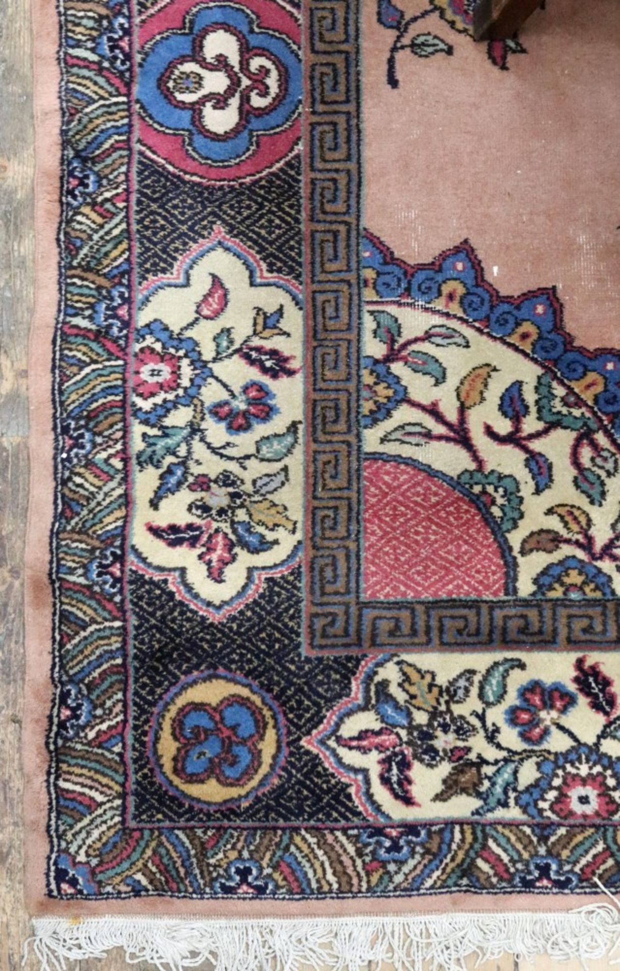 A Meshed carpet, the pink ground with a central floral medallion, 265 x 315cm.