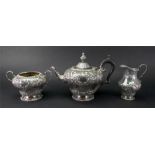 A Victorian silver three piece tea service, Mappin & Webb, Sheffield 1890, in George II style,
