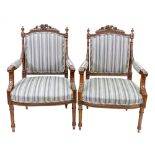 A pair of reproduction Louis XVI style mahogany fauteuil, the moulded frames with upholstered backs,