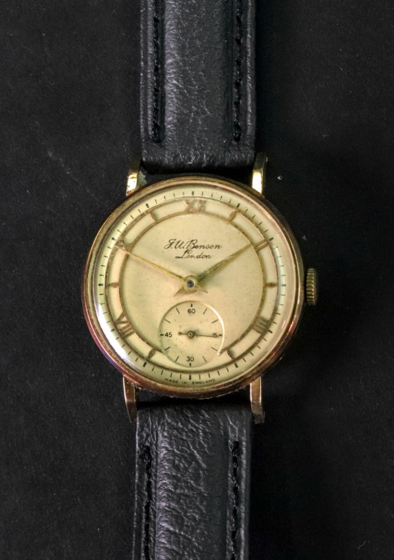 J W Benson; a gentleman's 9ct gold wristwatch, the dial with raised gilt Roman numerals,