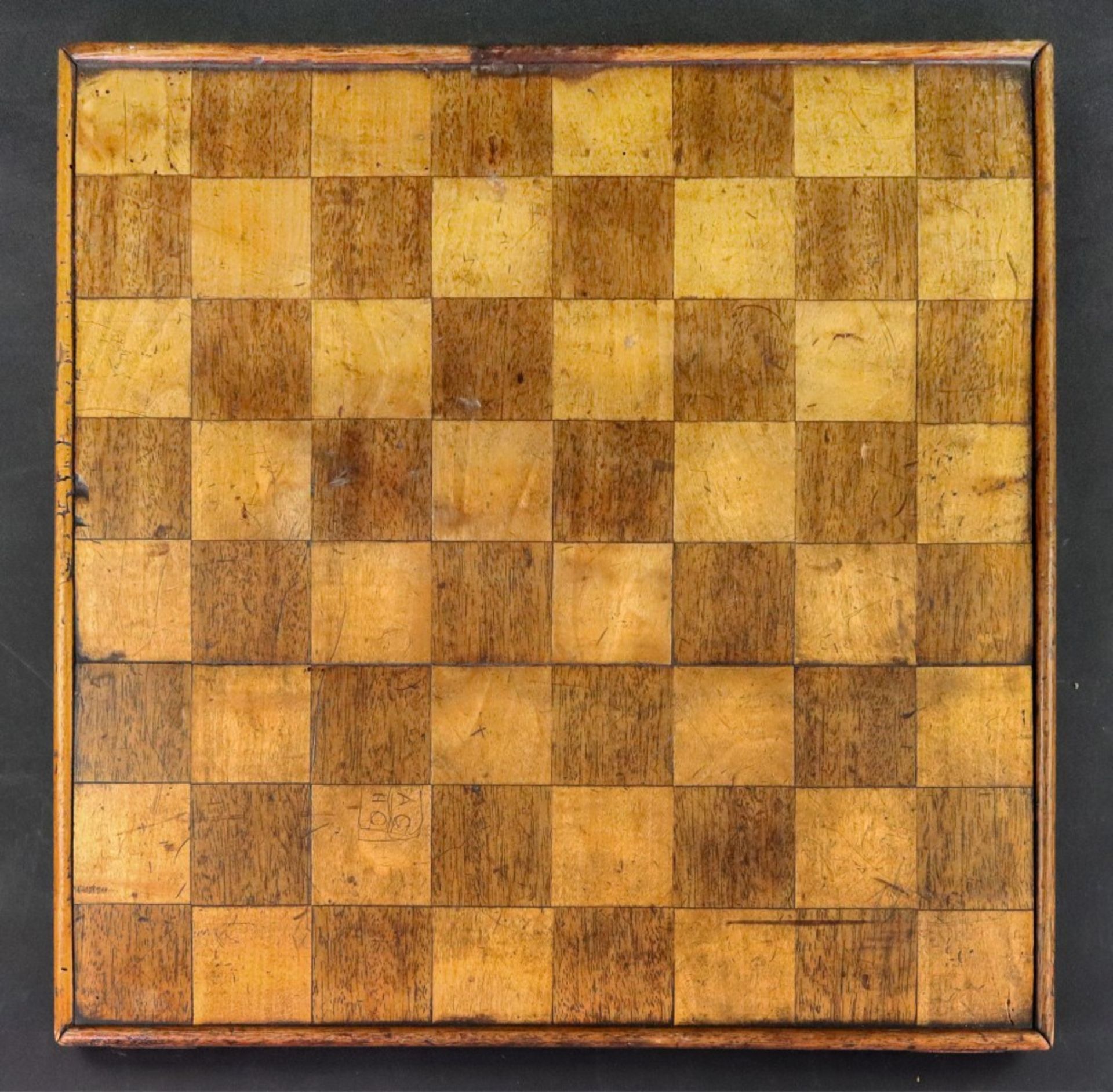 An early 19th century rosewood and satinwood chess board, with raised sides, 42 x 42cm.