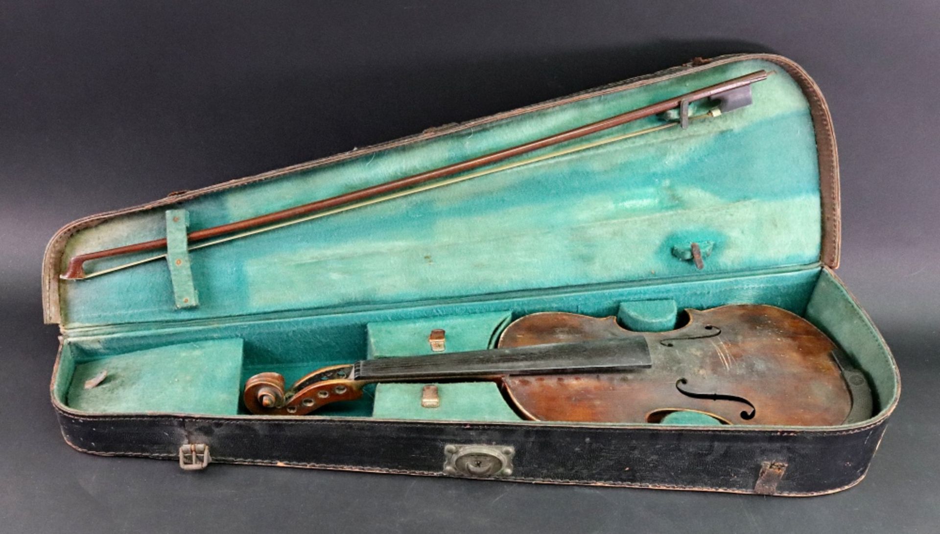 A violin, 60.5cm long, together with a bow in fitted Reliance leather carrying case.