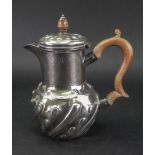 A late Victorian silver hot water pot, Edward Hutton, London 1893, in late 17th century style,