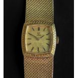 Omega; a lady's 18ct gold bracelet watch,