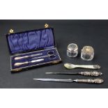 Two ornate silver handled paper knives, one, Birmingham 1904,