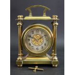 A late Victorian brass cased mantel timepiece,