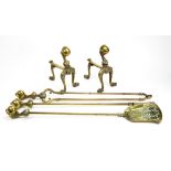 A set of three reproduction brass fire tools, with cast claw and ball capitals,