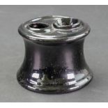 A Staffordshire 'Jackfield' style inkwell, circa 1760-70, of capstan form,
