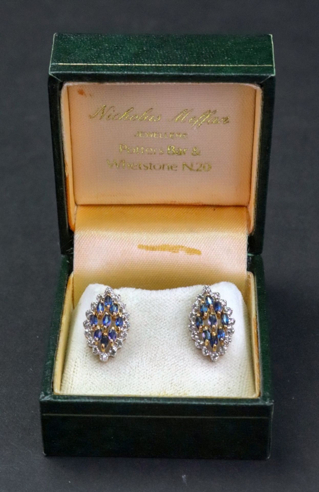 A pair of 9ct gold navette shape cluster earstuds, set with marquise sapphires and rose cut stones,