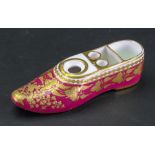 A Spode maroon ground inkwell, circa 1820, in the form of a slipper with well and two quill holders,