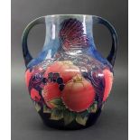 A Moorcroft two handled vase, circa 1994, tube lined and decorated with the 'Finches' pattern,