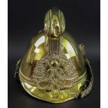 A French brass fireman's helmet, late 19th century, of typical form,