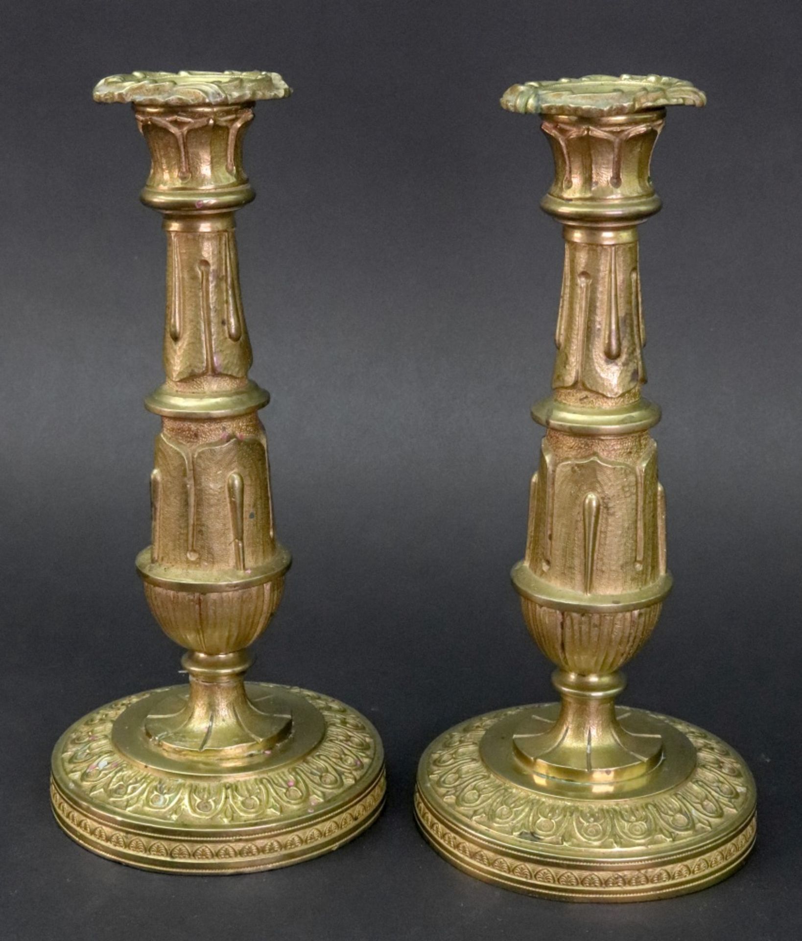 A pair of Empire style gilt metal candlesticks, 19th century,
