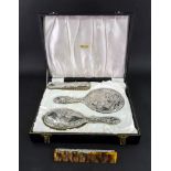 A cased four piece silver mounted dressing table set, Broadway & Co, Birmingham 1963,