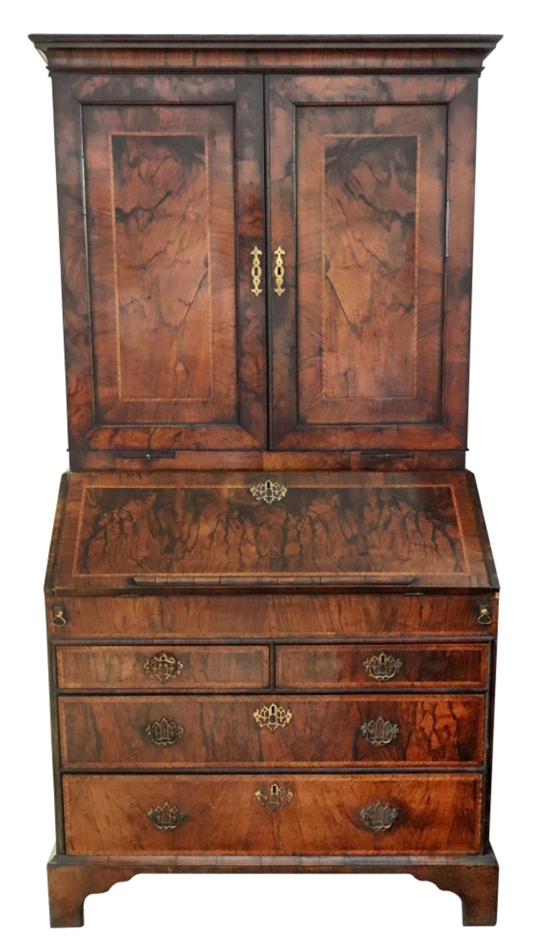 An early 18th century walnut cross and feather banded bureau cabinet,