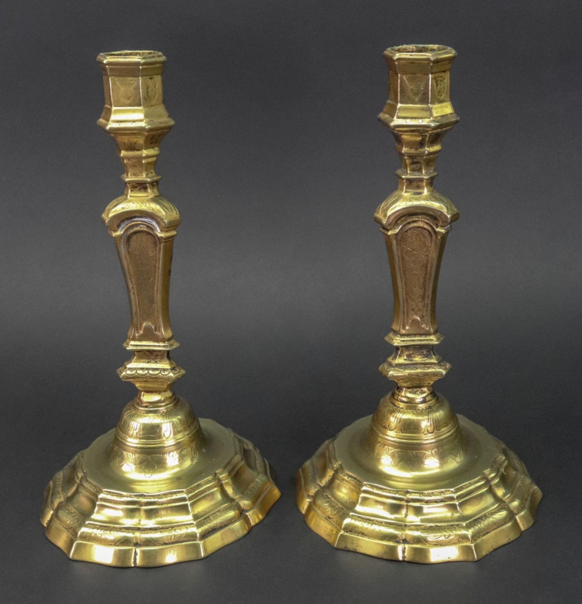 A pair of Regence style gilt metal candlesticks, of silver shape, with hexagonal nozzles,