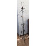 An Arts & Crafts black wrought metal brass and copper mounted oil lamp standard,