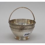 A Victorian silver sugar bowl, decorated to the handle and to the rims with beads,