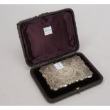 A Victorian silver shaped rectangular visiting card case, the exterior engraved with butterflies,