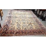 A Sarough carpet, Persian, the pale madder field with a stylised floral cross,