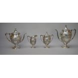 A Sterling silver five piece tea and coffee set, comprising; a teapot, a coffee pot,
