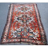 A Chelaberd Kazakh rug, Caucasian, the madder field with three bold ivory medallions,