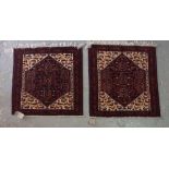 A pair of Baluchistan mats, with seven guls, ivory and bird spandrels, 76cm sq, (2).