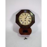 A late Victorian mahogany and brass inlaid octagonal wall clock, 31cm wide x 43cm high.