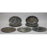 Nine polished limestone oval plates with fossilized inclusions,