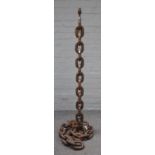 An unusual wrought iron standard lamp cast as large linked chains, 125cm high.