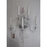 A modern five branch crystal wall applique,