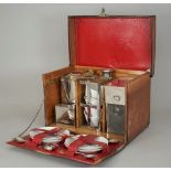 A mid-20th century leather cased picnic set,