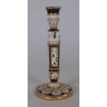A Wedgwood earthenware pierced candlestick, circa 1870, painted in brown and gilt on a cream ground,