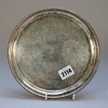 A Victorian silver salver, of circular form, with engraved decoration within a beaded rim,