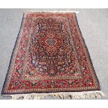 A Kashan rug,