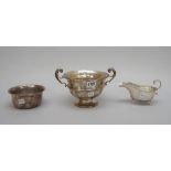 Silver, comprising; a twin handled trophy bowl, presentation inscribed, Birmingham 1912,